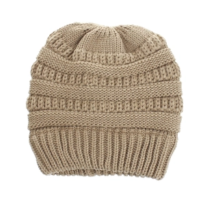 Close-up of khaki chunky knit beanie showing thick cable pattern and ribbed cuff detail