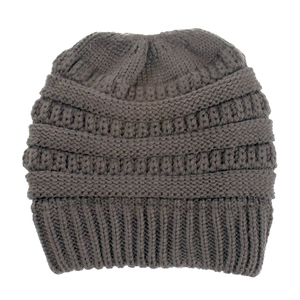 Detailed close-up of dark coffee knit beanie with ponytail hole and ribbed texture