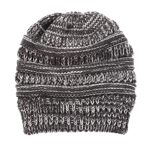 Detail of gray-white chunky knit beanie showing ribbing and thick texture weave