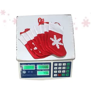 Set of 7 red Christmas felt mini socks with white snowflake patterns for cutlery