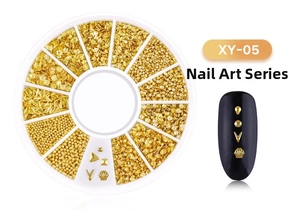 Close-up of gold star and moon nail art studs in a 12-slot circular rotating display case