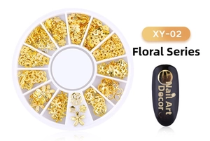 Detailed view of XY-02 golden floral alloy nail art charms in a 12-slot storage wheel