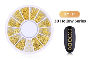 Close-up of golden 3D hollow star and moon alloy studs for nail art in storage box