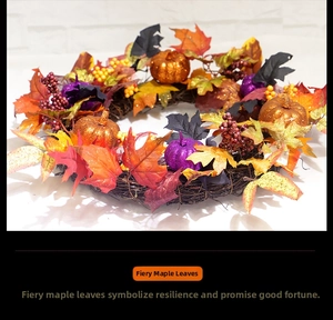 Detail of autumn wreath with maple leaves, glittery pumpkins and berries on vine base
