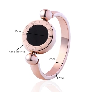 Rose gold Roman numeral rotating ring with black shell inlay and size dimensions