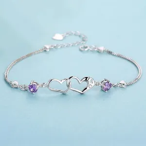Detailed view of S925 silver bracelet with interlocking hearts and purple accents
