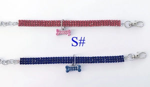 Detail of crystal pet necklaces in red and blue featuring sparkling bone shaped pendants