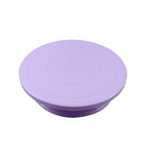 Detailed view of a purple plastic cake turntable with concentric measuring scales