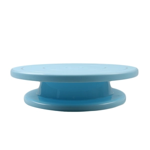 Detailed close-up of a blue circular rotating cake turntable made from durable plastic