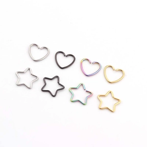 Set of heart and star shaped 316L stainless steel piercing rings in four metallic colors