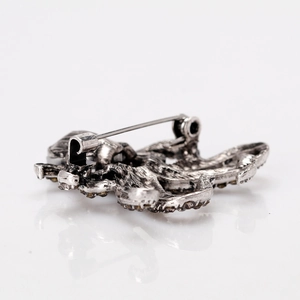 Vintage octopus brooch in antique silver finish with dark rhinestones and pin closure