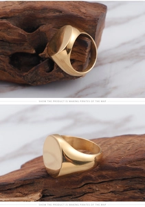 Macro shot of polished gold signet ring on wood showcasing solid steel texture