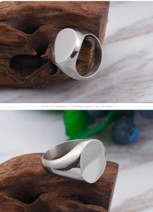 Dual view of a polished silver signet ring with an oval head on a natural wood surface