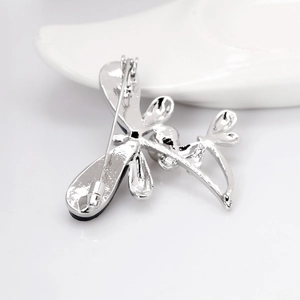 Silver dragonfly brooch pin back view showing secure clasp and polished metal finish