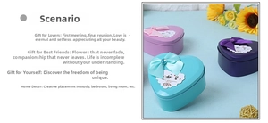 Three colorful heart-shaped tin boxes with ribbon bows and soap roses for gifts