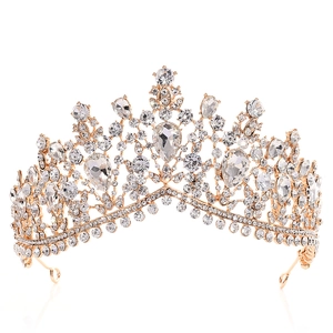 Detailed close-up of gold bridal crown featuring sparkling clear crystals and intricate metalwork