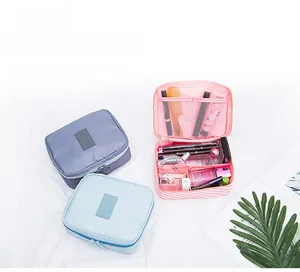Detailed view of the waterproof travel toiletry bag interior with multi-compartment mesh pockets