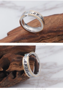 Macro detail of bimetal My Love engraved ring with brushed texture and square zircon