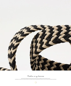 Macro detail of the high-density chevron woven pattern in black and white canvas fabric
