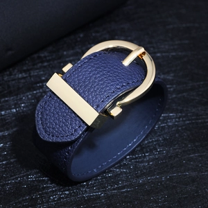 Minimalist blue lychee leather bracelet featuring a stylish golden horseshoe metal buckle
