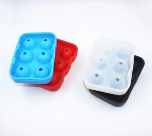 Detail of 6-hole silicone ice ball molds in red, blue, and black for round ice spheres