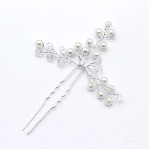 Detailed view of handmade silver bridal hair pin with white faux pearls and clear crystal beads