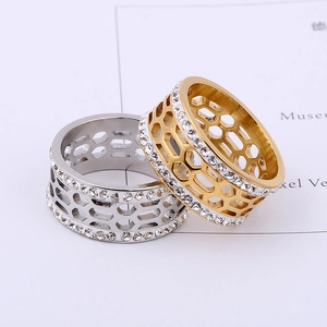 Macro view of geometric honeycomb rings in gold and silver with double row zirconia