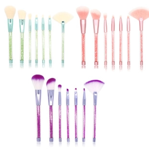 Detailed view of makeup brush sets with glitter handles in green, pink, and purple colors