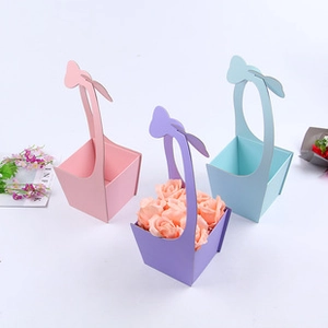 Three small envelope-style flower gift boxes in pink, purple, and blue colors