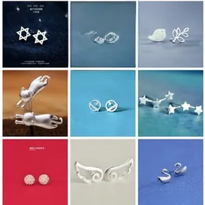 Macro detail of nine various 925 sterling silver stud earrings in different shapes