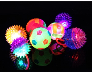Macro display of assorted glowing elastic spikes and football textured massage toy balls