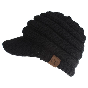 Close-up of black cable knit visor beanie with C.C leather patch and ribbed texture