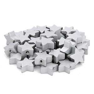 Close-up of silver star-shaped wooden beads with pre-drilled holes for DIY crafting