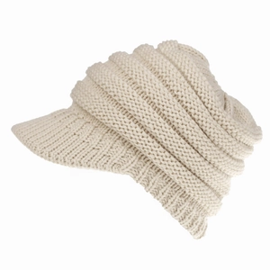 Detail view of the layered knit texture and short brim on this beige knitted baseball cap