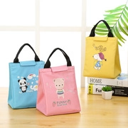Insulated linen lunch bags featuring cartoon bear, panda and snoopy patterns on a table