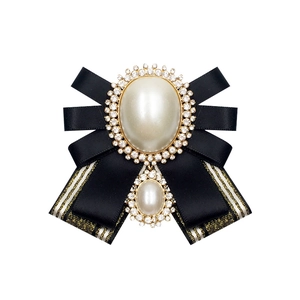 Elegant black satin ribbon bow brooch with crystal pearls and golden vintage finish