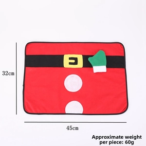 Macro detail of red Christmas placemat with Santa belt buckle design, 45cm x 32cm size