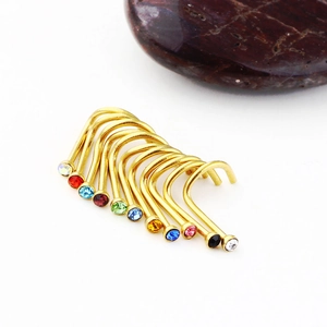 Set of 11 gold stainless steel nose studs featuring multi-colored crystal rhinestones