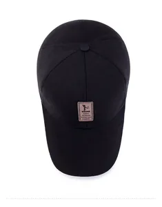 Top view of a black cotton baseball cap showing crown structure and brown leather patch
