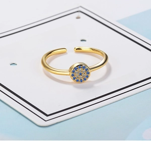 Detailed view of Turkish Evil Eye open ring with blue and white zircons in gold finish