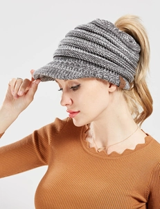 Detail of grey marl knitted ponytail beanie with leather C.C logo and ribbed texture