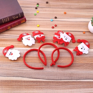 Christmas reindeer antler headband set with Santa and snowman motifs on wood background