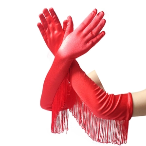 Dramatic pose of long red satin gloves with elegant fringe tassels for dance performances
