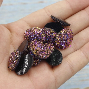 Close-up of 13x18mm oval purple resin druzy stone with glittering crystal texture