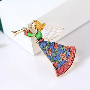 Cute enamel angel girl brooch with gold trim and wings on a white gift box surface