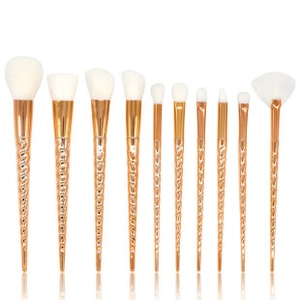 Detailed set of 10 rose gold unicorn spiral handle makeup brushes with white synthetic bristles