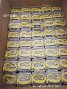 Bulk wholesale of yellow silicone pedometer watches packed in clear boxes in a factory carton