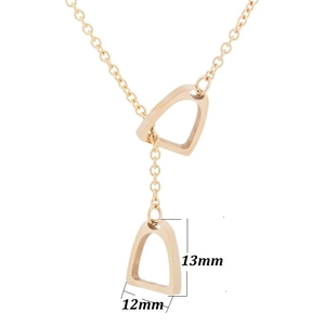 Detail of gold stirrup horseshoe pendant necklace showing 13mm by 12mm dimensions