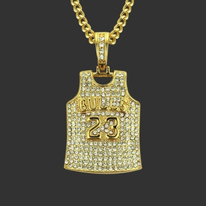 Detailed close-up of golden rhinestone Bulls 23 jersey pendant on hip hop necklace