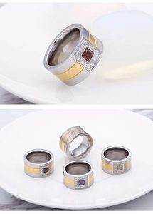 Macro view of two-tone titanium steel rings with square-cut multi-colored zircon stones